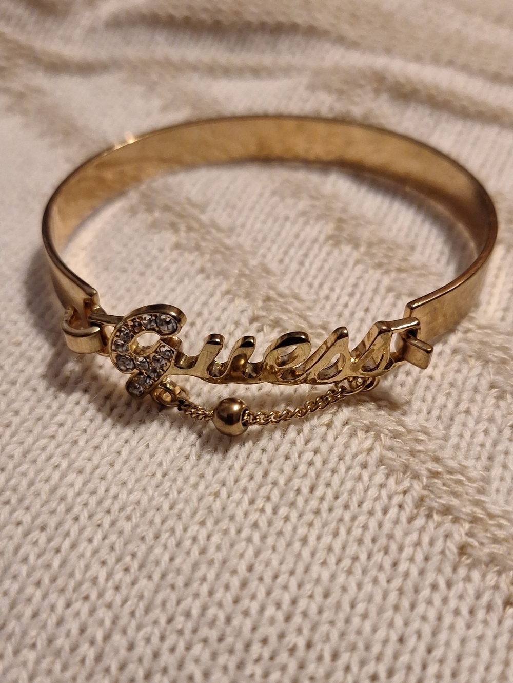 Guess Gold-Tone Script Logo Bracelet with Crystal Accent